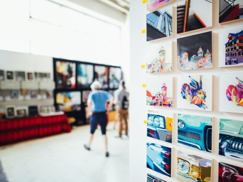 Art exhibit showing assorted colored paintings