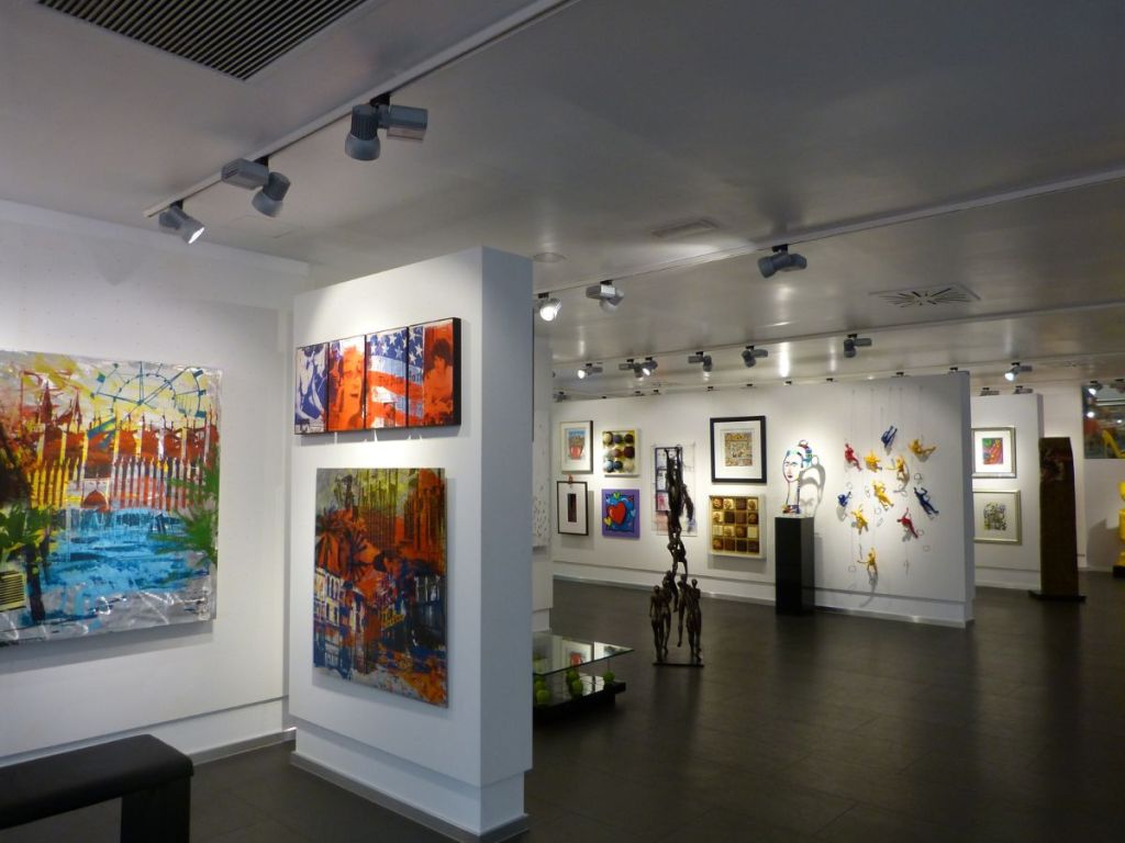 Art gallery displaying various paintings and art